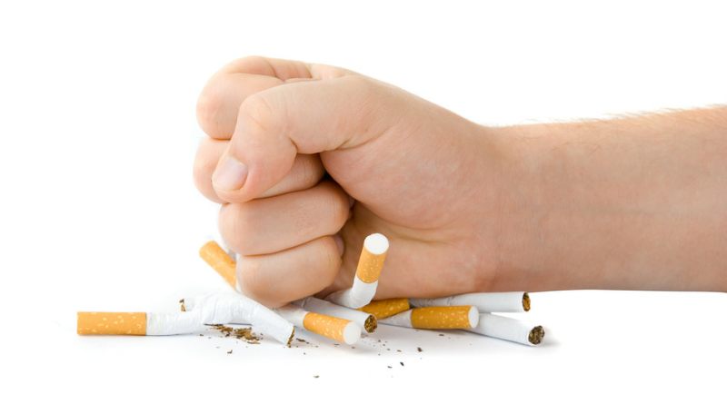 Cigarettes-crushed-under-a-fist
